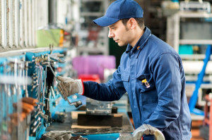 Portrait of a worker searching for the right tool