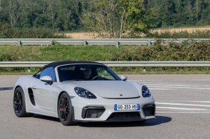 View on a grey Porsche 718 Spyder driving on a road