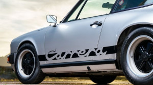 Porsche 911 Carrera parked showing the drivers side