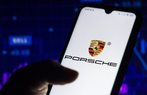  the Porsche AG logo seen displayed on a smartphone screen